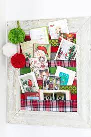 Making christmas place card holders for the table is as simple as tying two sprigs of holly together and placing a card between the berries. Christmas Card Holder You Can Make Tonight In My Own Style