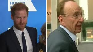 Prince William dons boxing gloves during visit to the Centrepoint  homelessness charity as Prince Harry's lawsuit against the tabloid press is  delayed across town