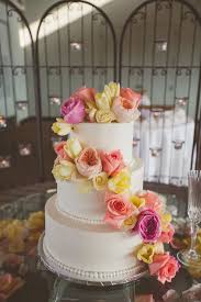 Maybe you would like to learn more about one of these? White Wedding Cake With Coral Cascading Flowers