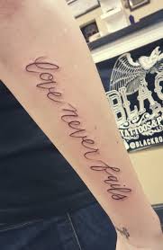 Love Never Fails Forearm Tattoo Tattoos Forearm Tattoo Body Mods