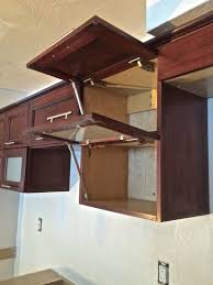 Building your own kitchen cabinets seems a little intimidating. Basement In Law Kitchen Flip Up Doors On Maple Cabinets With A Rich Mahogany Stain Frosted Glass Com Quality Custom Cabinetry Custom Cabinetry Maple Cabinets