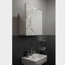 A mix of ann sacks surfaces, including a pebble wall covering, brings a warm feel to a guest bath of an aspen, colorado, home which was renovated by stonefox architects. Award Winning Bathroom Lighting