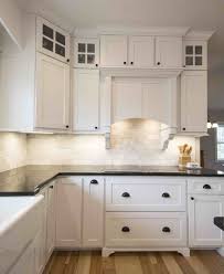 Kitchen With White Inset Shaker Cabinets Stacked Glass Cabinets Custom Hood With Co White Cabinets Black Countertops Kitchen Hood Design White Shaker Kitchen