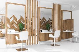 These beauty uniforms must be elegant and stylistic. Beauty Salon Or Barber Shop Interior Design With White And Wooden Walls Large Mirrors And White Chairs Near Tables With Creams And Towels 3d Rendering Stock Photo Picture And Royalty Free Image