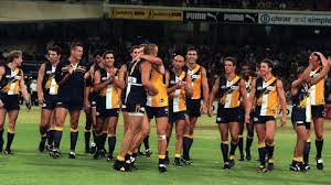 Fraser gehrig sharing his love of meat pies. Afl 2019 Best Ever Afl Photos Iconic Images Tony Lockett 1300th Goal Barry Hall Headlock