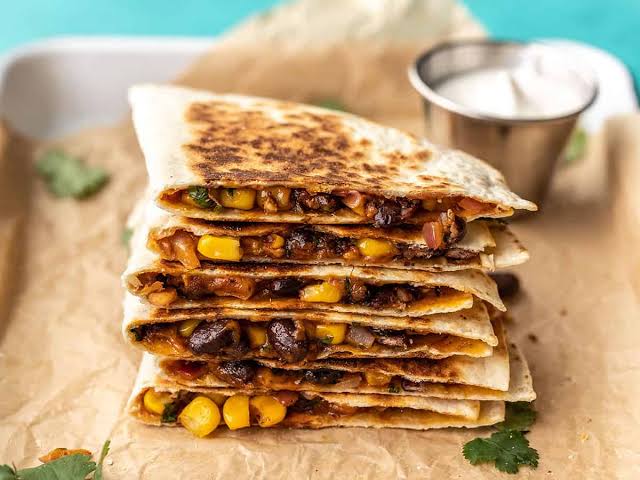 Crisp, nutrient-dense Southwestern black bean quesadillas., AI generated