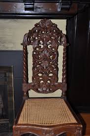 Carved Chair Of Philippine Narra Wood With Cane Seat By Traudi Thomason Wood Table Wood Carving Faces Carved Chairs
