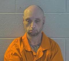 WANTED SUSPECT LOCATED INSIDE RESIDENCE IN PULASKI CO., KY COWERING UNDER A  BED