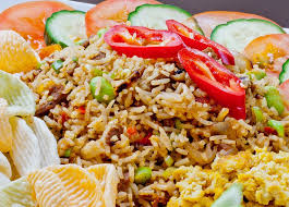 Indonesian Nasi Goreng Served With Veggie Chips Slices Of Cucumber And Tomato And Scrambled Tofu Indonesian Fried Fried Rice Vegan Rice Dishes Nasi Goreng