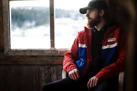 Do other colored outfits make you nauseated? Free Photo Photo Of Man Wearing Black Hat And Blue And Red Jacket Near Window Adult Pose Winter Free Download Jooinn