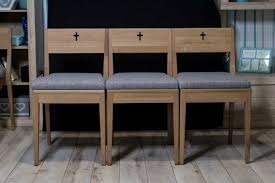 Interior of the modern minor basilica of most holy trinity with a view over the altar, aisles and pews. Zoe Church Chairs For Sale