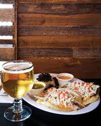 Each is topped with cheddar cheese, cabbage, tomato, onion, crema and cilantro. Five Spots For Fish Tacos Charlotte Magazine