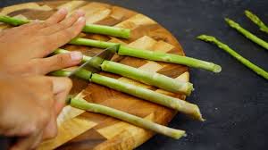 The best way to trim asparagus is also the most obvious way: 3 Ways To Cut Asparagus Wikihow