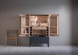 The grande drinks cabinet features a clean white body and solid oak legs. These Home Cocktail Bar Ideas Are Perfect For The Party Season