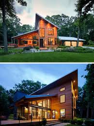 This modern lake house has multiple sloped roofs to allow the rain and snow slide off. 16 Examples Of Modern Houses With A Sloped Roof Modern Roof Design House Roof Design Modern House Plans
