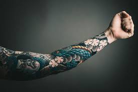 photo of left arm with tattoo art