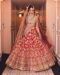 A Bride Can Never Go Wrong With Traditional Shades Of Red And Gold Especially When It Is A Ma Indian Bridal Dress Indian Bridal Outfits Indian Wedding Outfits