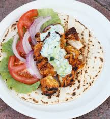 Skinless legs and thighs are marinated in a tenderizing mixture of yogurt, lemon juice, and spices and the meat is slashed to the bone in several places helping the marinade. Tandoori Chicken Tikka Wrap Season With Spice