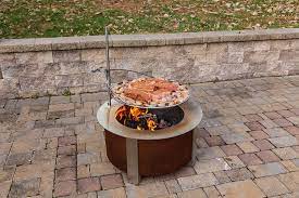 They, the store i bought it from didn't have the version with the normal ring, so i went with what was then called the phoenix. This Ultimate Campfire Grill Turns Your Fire Pit Into A Tiered Cooking Machine With A Winch Fire Pit Fire Pit Grill Cool Fire Pits