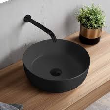 round matte black vessel sink in