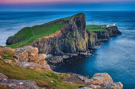 Check out the neist point lighthouse. White Lighthouse On Green Grass Field And Large Rock Formation Near Body Of Water Neist Point Hd Wallpaper Wallpaper Flare