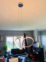 Fully adjustable, the light installs easily into any room, giving the space a modern aura. Artika Swirl Integrated Led Pendant