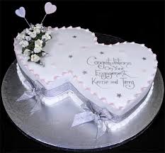 The first and foremost step is to you can draw inspiration from this cake design that has a cupid's arrow striking the two engagement rings which makes it a perfect announcement. Engagement Cakes The London Cake Company