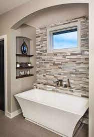 The rough brick wall and unfinished wood table of this space contrast with the smooth, geometrical look of the washbasin and mirror. 50 Inspiring Bathroom Design Ideas Master Bathroom Renovation Bathroom Remodel Master Small Bathroom Remodel