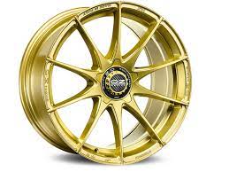 Pink an gold alloy rim wheel with a complex multi spokes design with pink racing tyre. Alloy Wheels Formula Hlt 5h Oz Racing