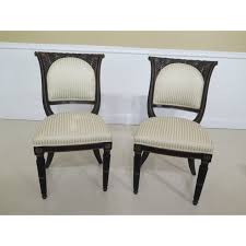 Set of four art deco (transitional from art nouveau) chairs attributed to sue & mare made of beechwood and painted in a burgundy color with gold leaf gilded carved ornaments on. Vintage Regency Style Black Gold Dining Room Chairs Set Of 12 Chairish