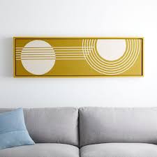 Decorate with loose linens, a netted pendant light, and a vintage area rug for a pop of color. Radiant Shapes Wall Art