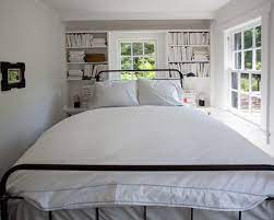 It includes two nightstands and one bed, all made from a blend of solid and engineered wood in a neutral hue. Ways To Make A Small Bedroom Look Bigger