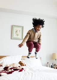 Download Premium Image Of Young Happy Kid Having Fun Jumping Up And Down In 2020 Happy Kids Kids Playing Photography African Children