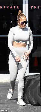 Jennifer lopez puts her killer curves on display in a neon pink bikini. Jennifer Lopez Wears Two Midriff Baring Outfits For Day Of Miami Shopping With Twins Max And Emme Daily Mail Online