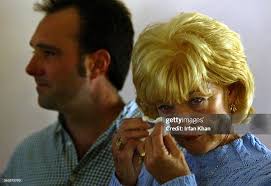 Norco. December 08,2003. ––– Carol Kula wipes her tears as she... News  Photo