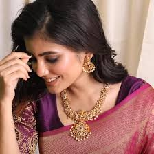 Buy TARINIKA Antique Gold Plated Jaya Long Necklace Set with Lakshmi Idol &  Peacock Design