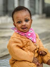 Photo of a Smiling Baby in a Pink Outfit · Free Stock Photo