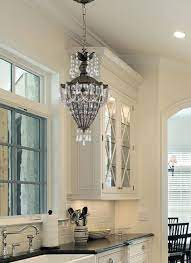 Charming Oil Rubbed Bronze Kitchen Island Lighting Using Art Deco Cast Iron Chandelier With Small Candle Lamp Shades Over Kitchen Sink Home Beautiful Kitchens