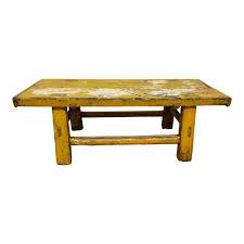 This versatile furniture boasts a round top with a fixed bottom shelf for books or magazines. Distressed Yellow Lacquered Bench Coffee Table Design Plus Gallery