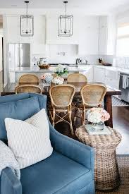 Side chairs, dining chairs, lounge chairs, and everything in between; Brown Oval Wooden Dining Table With White Wicker Chairs Transitional Dining Room