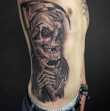 The reaper's face is visible in this tattoo, however, and is presented as a simple but scary skull. 50 Traditional Grim Reaper Tattoo Designs With Meaning 2020
