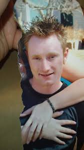 Please could someone remove the hand and suit jacket either side of my nan,  also the orange stain