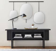 Finished in a natural orchard brown to enhance the wood tones, the sides of the top are hinged and can easily be folded out to use as a dining table when friends stop by, or as a desk when you have paper work to do. Buy Convertible Console Dining Table Online Pottery Barn Uae