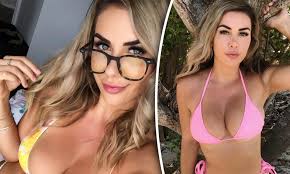 Shelby Bilby showcases her ample bust in a body-hugging swimwear