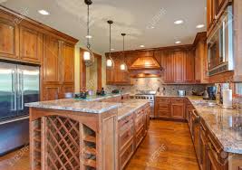 Learn 10 creative ways to save a kitchen remodel before you get started on one. Gourmet Kitchen Boasts A Bar Style Kitchen Island With Built In Stock Photo Picture And Royalty Free Image Image 97101785