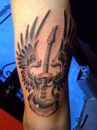 In these page, we also have variety of images available. 15 Best Guitar Tattoo Designs With Meanings For Girls Guys Guitar Tattoo Design Guitar Tattoo Hand Tattoos