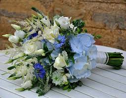 Blue flowers for weddings and events. Lovely Wildflower Style Hand Tied Wedding Bouquet Featuring Blue Hydrangea Blue Nigella Flower Bouquet Wedding Daisy Wedding Flowers Wedding Flower Trends