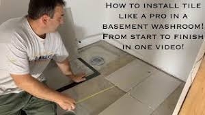 Whether you want to refinish an uneven basement floor, or replace or add new flooring on top of an existing concrete floor somewhere in your home, you most likely will need to level the concrete floor. How To Install Tile In A Basement Washroom Floor On Concrete Like A Pro Start To Finish Youtube
