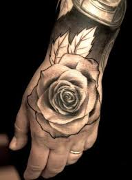The tattoo covers the entire back starting just below the back of the neck reaching all the way down till the buttocks. Promobonus On Twitter Rose Hand Tattoo Tattoos For Guys Hand Tattoos