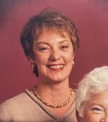 Can someone edit this photo of my mom and remove the boy. It's for her  funeral please. Brighten and enhance if possible